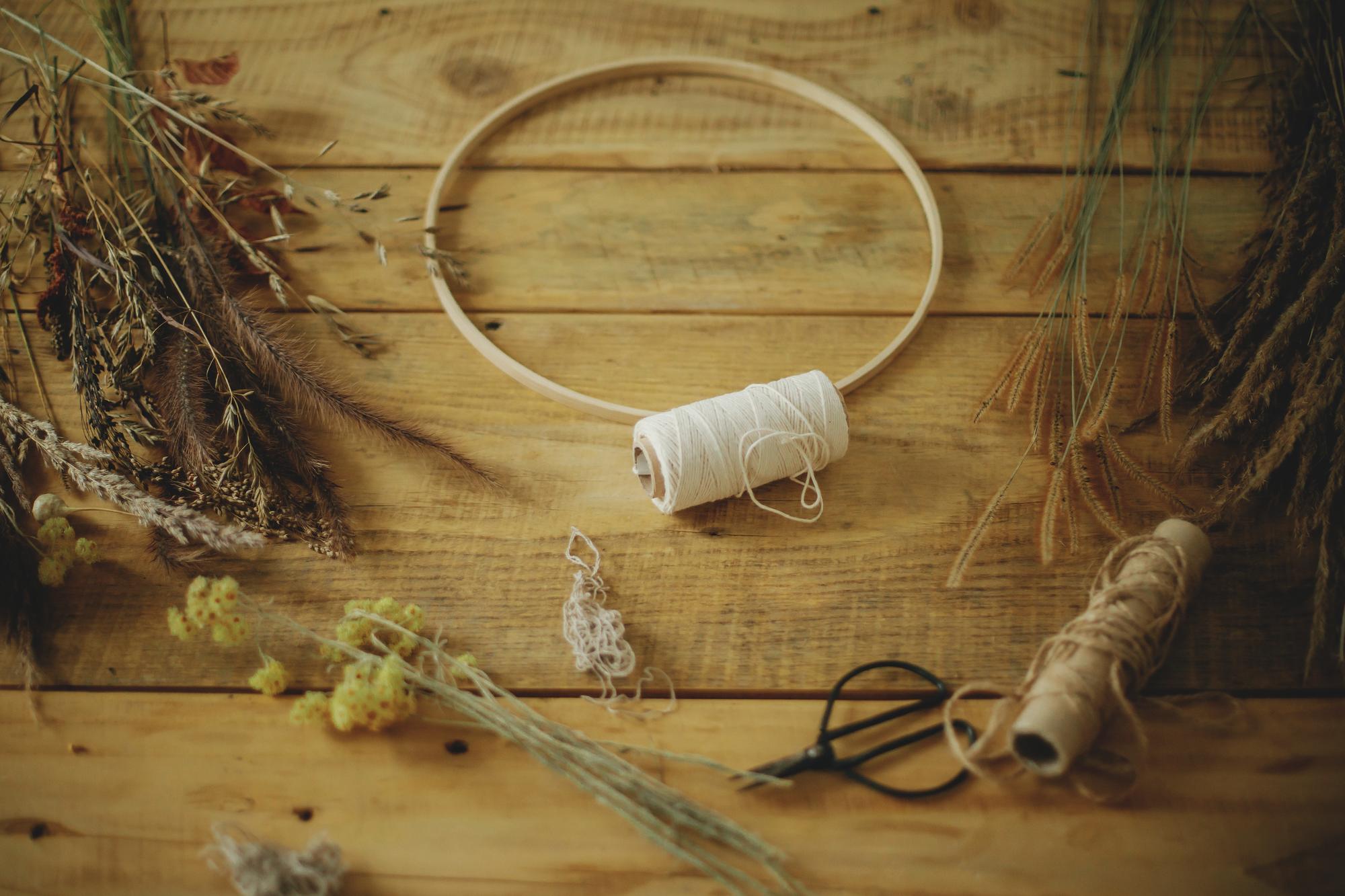 Interior of small embroidery studio with threads and hoops